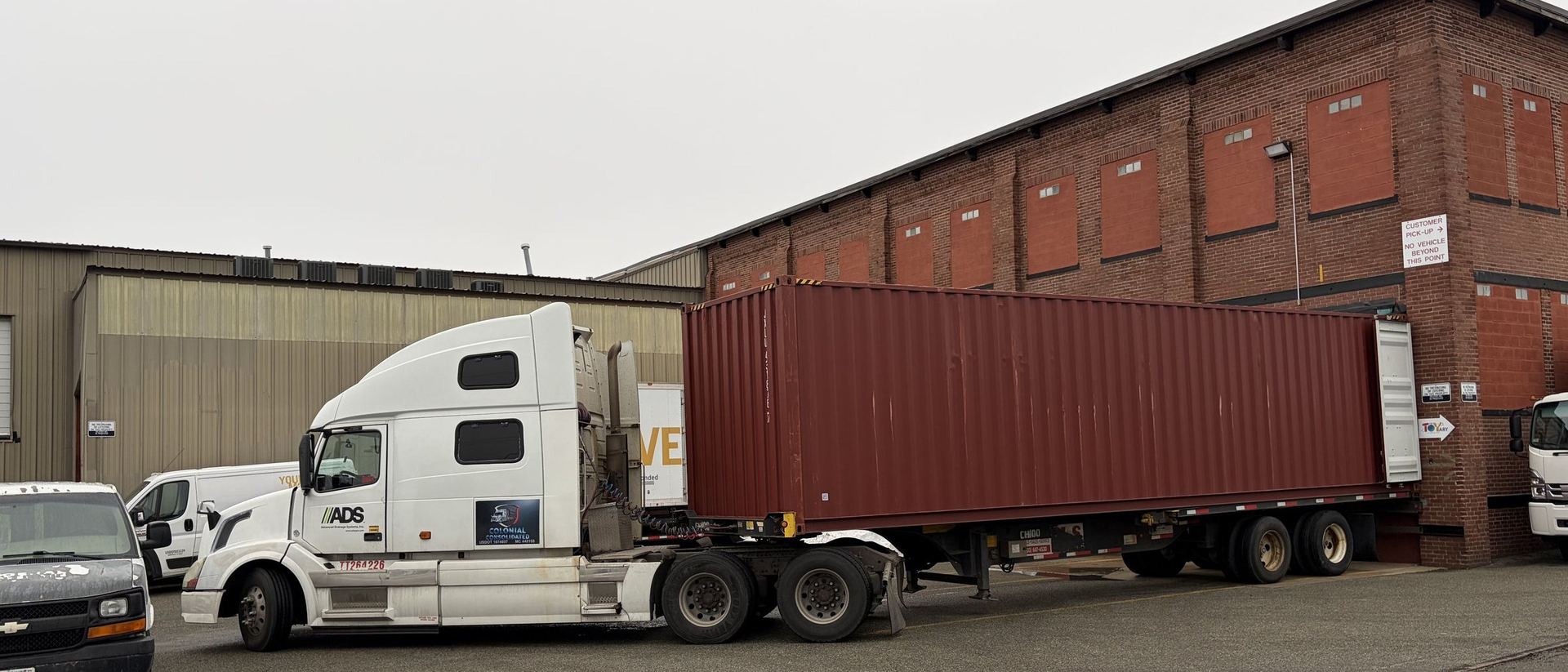 Container truck backed up to the D&S loading dock