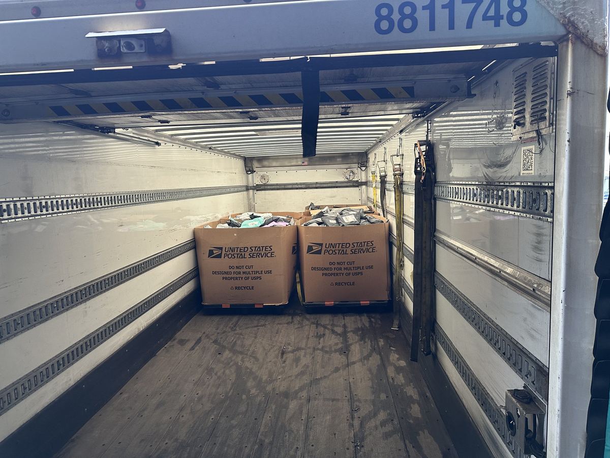 Truck loaded with USPS bulk containers